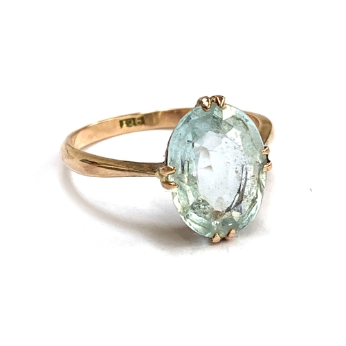 16 - An early 20th century 9ct gold and aquamarine solitaire ring, the stone 1.2cmL, size P
