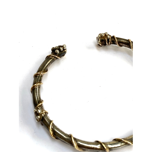 29 - A white metal Brutalist style bangle with wrapped wire detail, 8cmW, 42.3g