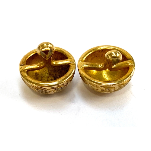 36 - Two 19th century gold buttons with floral engraved detail, unmarked but test as 18ct or higher, 1.2c... 
