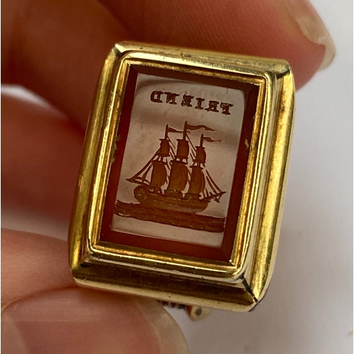 4 - A 19th century gold cased fob seal, the carnelian intaglio engraved with 'Friend' above a ship, 3.1c... 