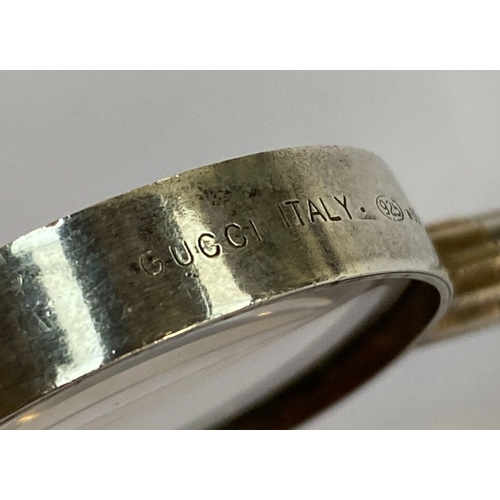 55 - A vintage Gucci 925 sterling silver magnifying glass pendant with gold plated detail, 6.5cmL, stampe... 
