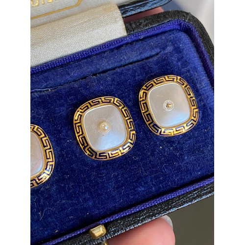 32 - A set of four 18ct gold, enamel, mother of pearl and pearl buttons, the mother of pearl panels surro... 