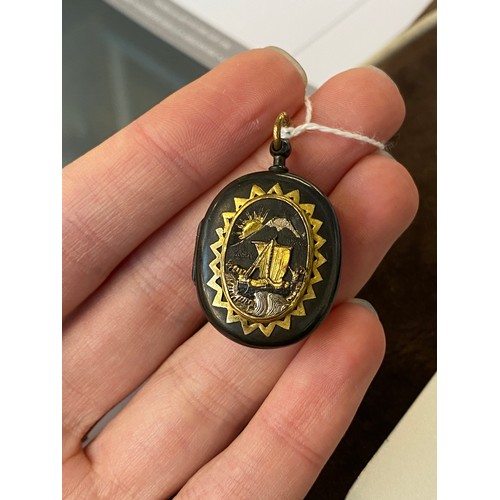 52 - A 19th century Japanese Shakudo locket, with applied silver and gold decoration, one side depicting ... 