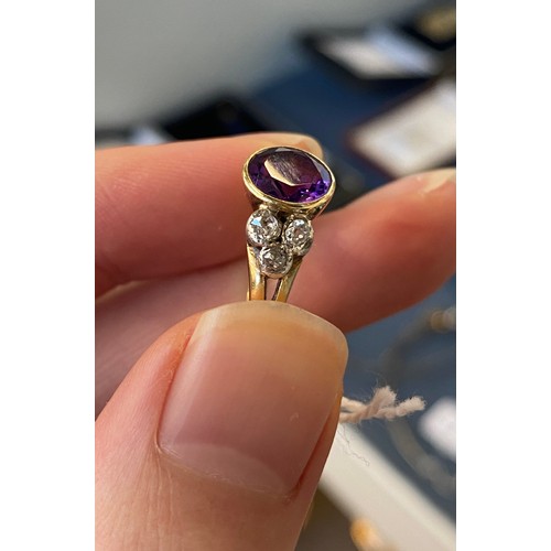 10 - An early 20th century 18ct gold, amethyst and diamond ring, the bezel mounted central stone 8mm wide... 