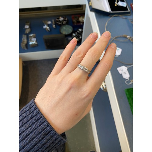 25 - A Victorian 18ct gold and diamond five stone ring, the open backed diamonds in cut down silver colle... 