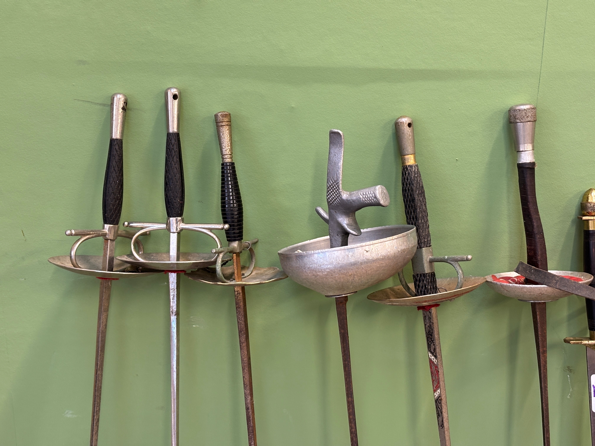 A quantity of swords, and fencing weapons, including a foil, and epee ...