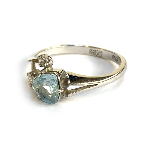 22 - A 14ct white gold, blue topaz and CZ ring, the trilliant cut topaz 6mmD, size O, 2.4g
