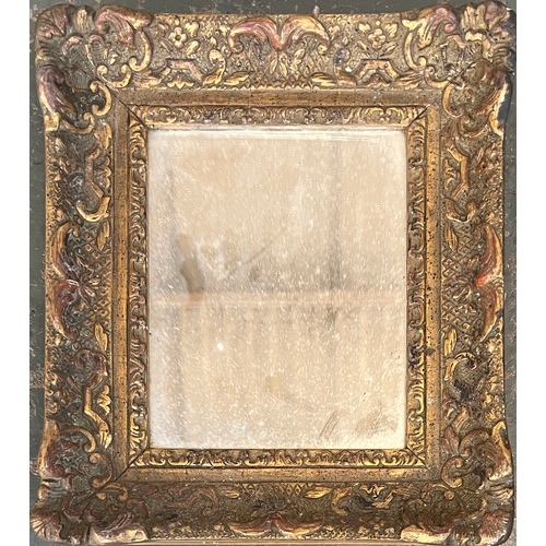 721 - A very small gilt gesso picture frame, now with mirrored plate, internal dimensions 11x13.5cm