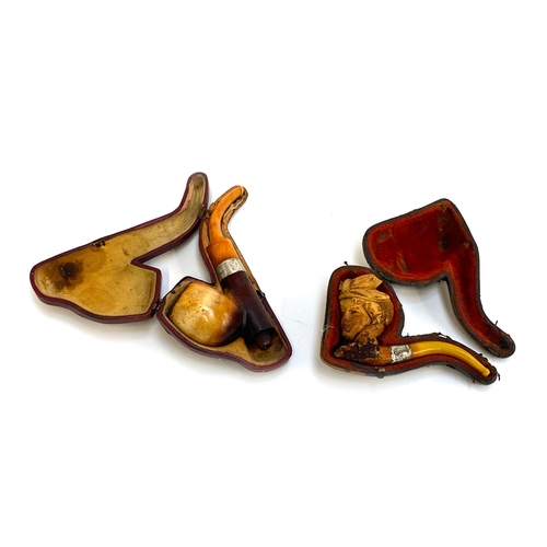 49 - Two silver collared pipes: one Meerschaum pipe in the form of a lady wearing a hat and one other wit... 
