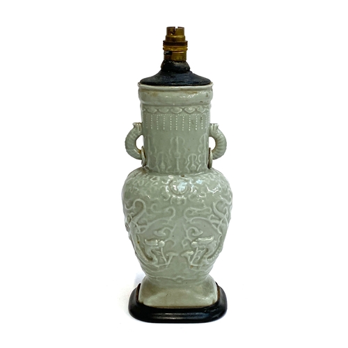160 - A Chinese twin handled celadon glazed vase converted for use as a table lamp, with twin dragon lug h... 