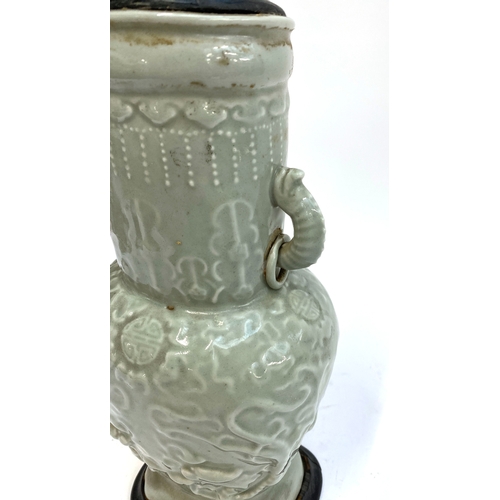 160 - A Chinese twin handled celadon glazed vase converted for use as a table lamp, with twin dragon lug h... 