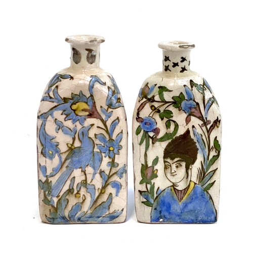 192 - A pair of Persian Qajar Iznik style tri-sided pottery vases, one decorated with a youth and horse, t... 