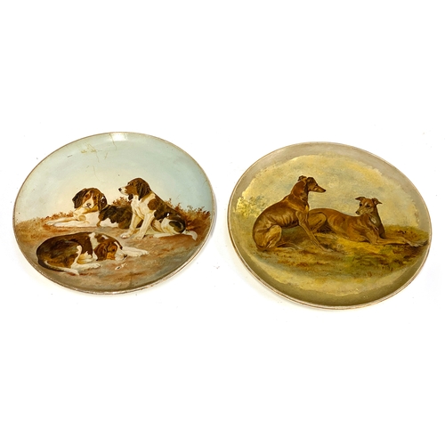 205 - Two early 20th century chargers hand painted with whippets and beagles, 36cmD