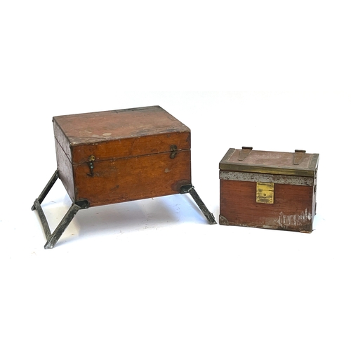 1134 - A teak, brass, and steel bound case/box, 28cm wide; together with a dovetailed teak box with foldout... 