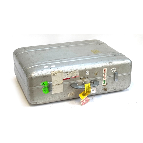 1110 - A vintage 1950s Halliburton aluminium suitcase, with travel stickers, 61cm wide