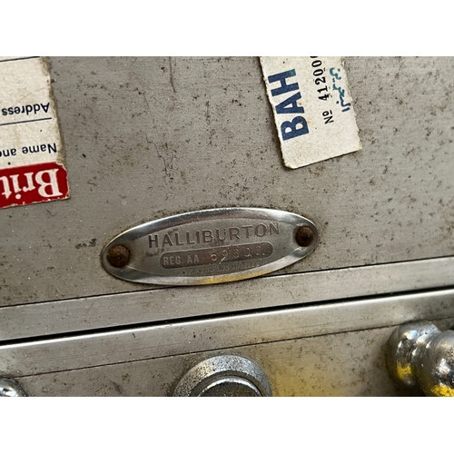 1110 - A vintage 1950s Halliburton aluminium suitcase, with travel stickers, 61cm wide