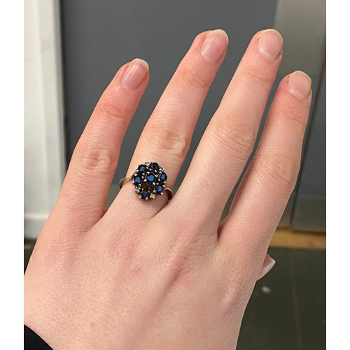 16 - A silver and sapphire cluster ring, size M 1/2, 4g