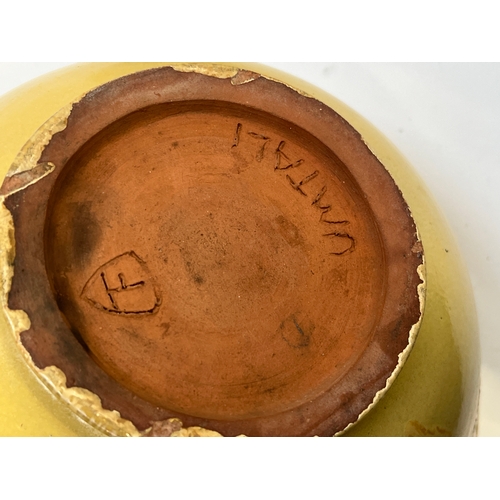 259 - A large stoneware fruit bowl decorated with a band of people in relief, signed Umtali to base, 33cmD... 