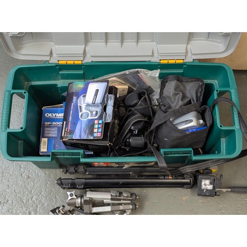 524 - A crate of cameras and equipment to include: Medion DVC 505 video camera, Polaroid, Nikon Coolpix, e... 