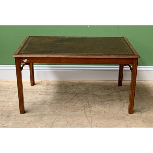 1194 - A mahogany coffee table in George III taste, with leather inset top, on square moulded legs, 86x53x4... 