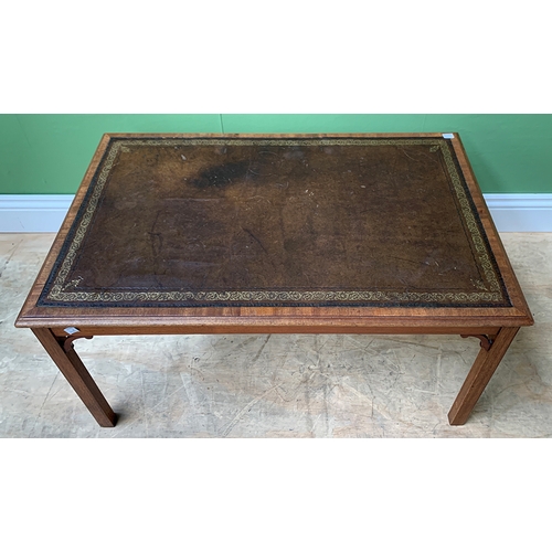 1194 - A mahogany coffee table in George III taste, with leather inset top, on square moulded legs, 86x53x4... 