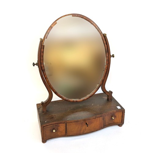 1204 - A George III oval box mirror, three serpentine drawers with barbers pole stringing (af) 46cmW
