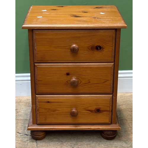 1225 - An orange and silver painted side table, 47x32x58cmH, together with a pine bedside table of three dr... 