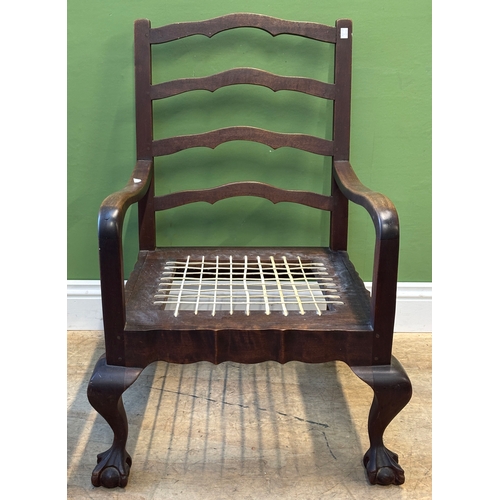 1291 - An open armchair, missing cushion, with ball and claw feet