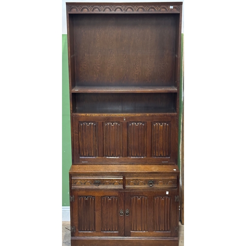 1301 - A pair of oak bookshelves with linen fold cupboards below approx. 92cmW 204cmH