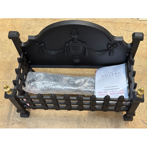 1320 - A cast iron fire grate, of recent manufacture, by 'The Gallery Collection', 57cmW