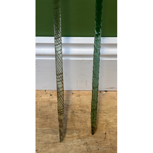 288 - Two Victorian 'frigger' glass walking canes, both of twisted form, 133cmL and 92cmL