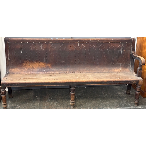 1030 - A very long bench/settle, in two parts, on turned front legs, approx. 400cmW
