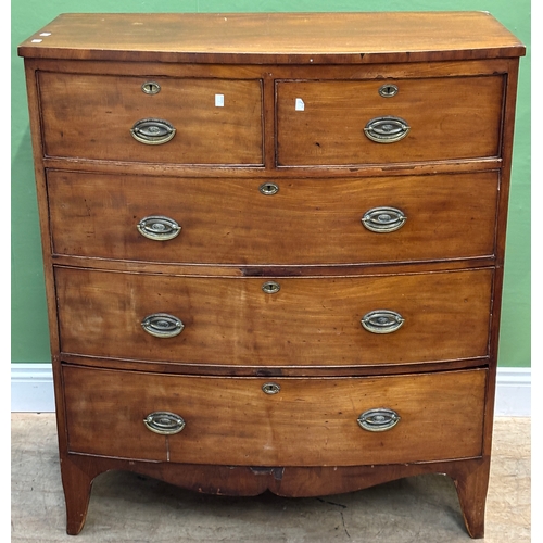 1051 - An early 19th century bowfront mahogany chest of two short over three long drawers, on bracket feet,... 