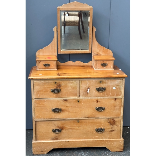 1074 - A small pine chest of two short over two long drawers on bracket feet, with a super structure with a... 