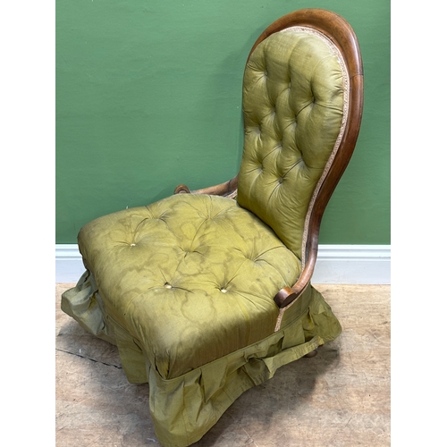 1119 - An olive green button upholstered bedroom chair on casters