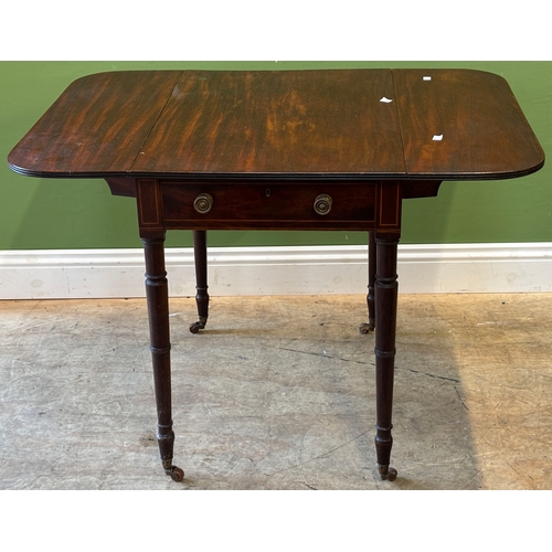 1177 - A Regency mahogany Pembroke table with single end drawer on ring turned tapering legs on brass caps ... 