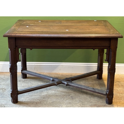 1238 - A Victorian gothic revival oak centre table, on carved supports joined by X stretcher, 111x78x76cmH