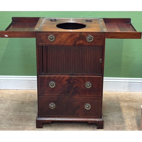 1267 - A George III mahogany washstand, the double hinged top opening to an aperture for a washbowl, over a... 