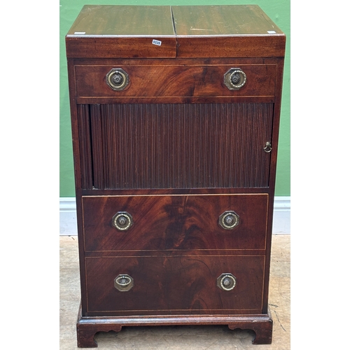 1267 - A George III mahogany washstand, the double hinged top opening to an aperture for a washbowl, over a... 