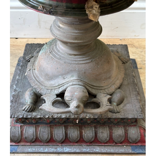 1109 - A seven tier Indian brass Deepam with tortoise base, surmounted by a peacock 170cmH