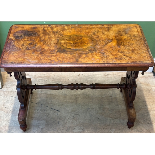 1251 - A Victorian walnut centre table with pierced end supports joined by turned stretcher, 90x46x67cmH
