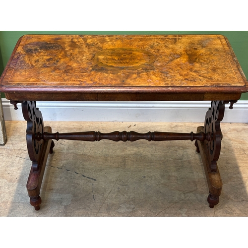 1251 - A Victorian walnut centre table with pierced end supports joined by turned stretcher, 90x46x67cmH