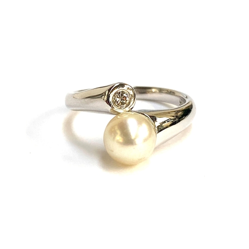 30 - A 14ct white gold, diamond and pearl crossover ring, the pearl 8mmD, size M, 4g