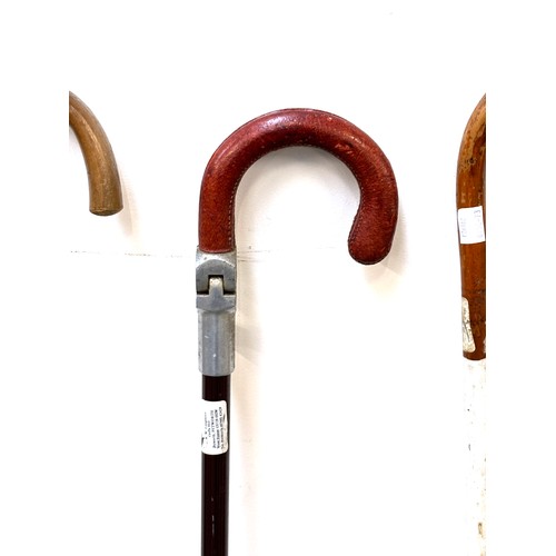 1138 - A quantity of walking sticks to include one made from Antelope horn, ash and hazel, an aluminium and... 