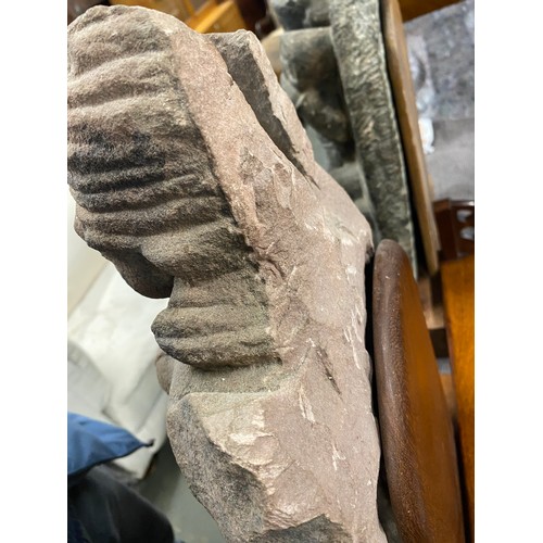 1240 - An Indian carved sandstone statue depicting the god Surya flanked by diminutive attendants, 47cmH ex... 