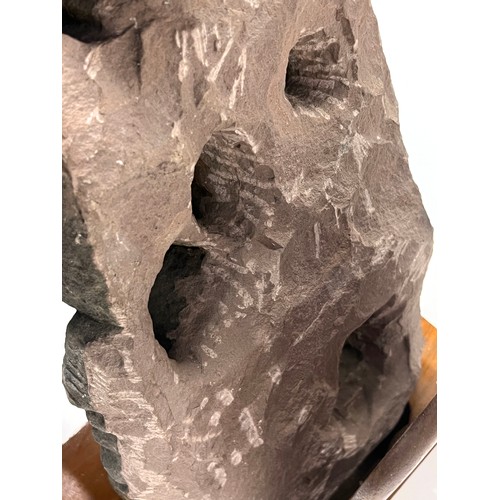 1240 - An Indian carved sandstone statue depicting the god Surya flanked by diminutive attendants, 47cmH ex... 