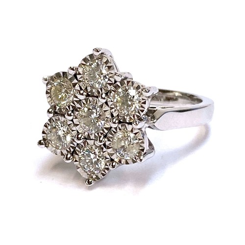 22 - A heavy 18ct white gold and diamond floral cluster ring, the diamonds each 3mmD and totalling approx... 