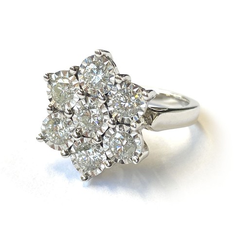 22 - A heavy 18ct white gold and diamond floral cluster ring, the diamonds each 3mmD and totalling approx... 