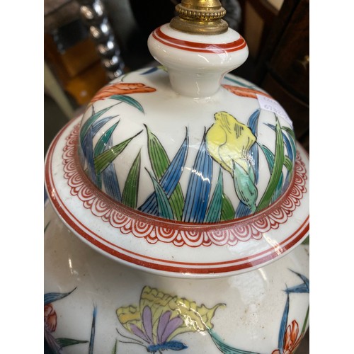 1084 - A large ceramic table lamp decorated with irises, 40cmH to base of fitting