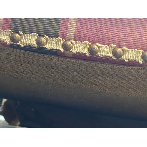 1288 - A good three seater sofa in a green and pink striped fabric, with feather filled cushions, on square... 